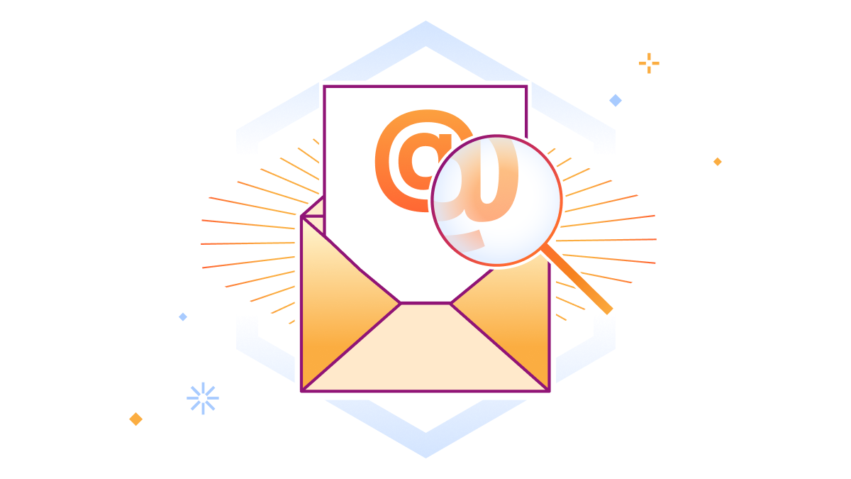 Email @ sign being enlarged by a magnifying glass